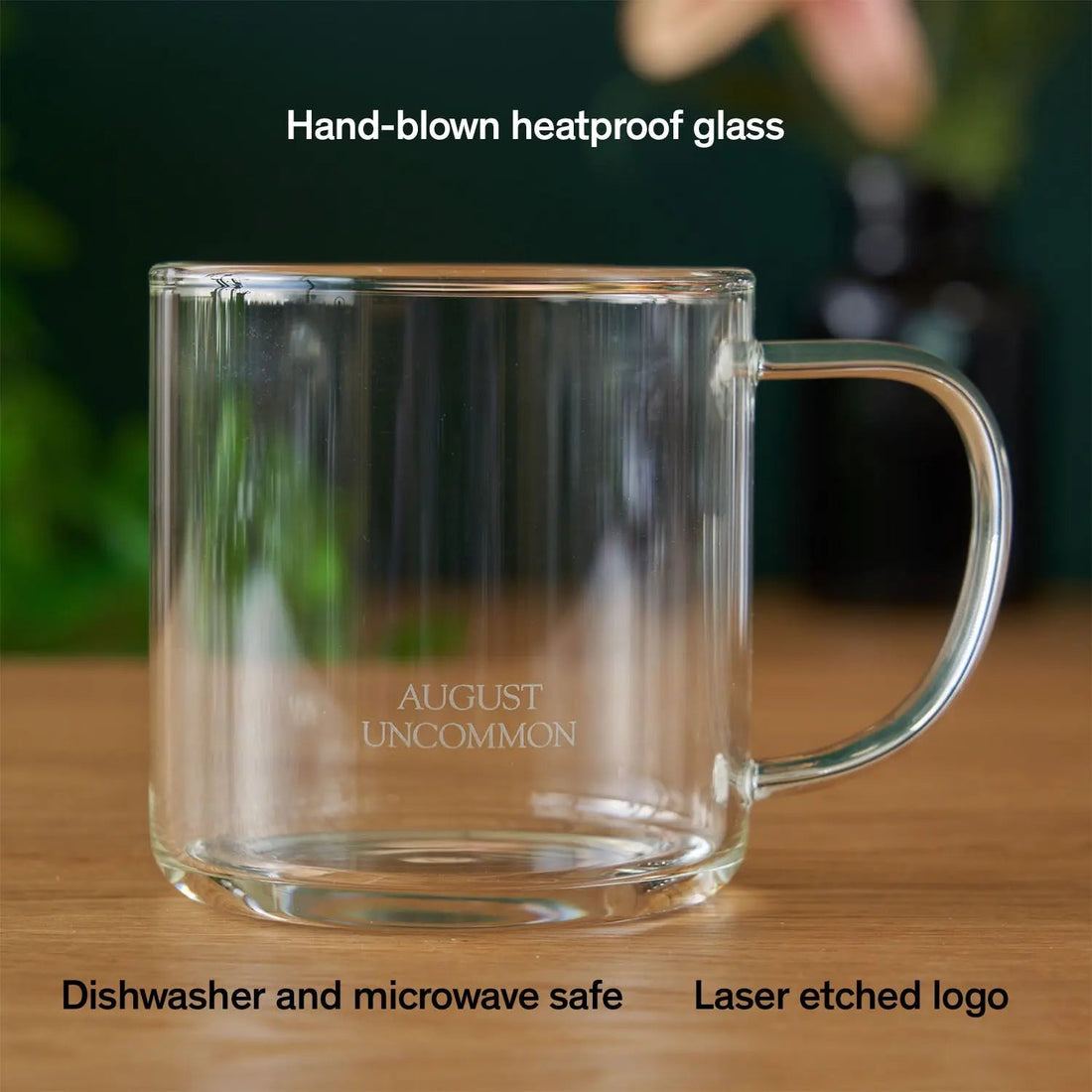 Clear glass mug for tea from August Uncommon Tea, showcasing its elegant, transparent design and smooth handle.