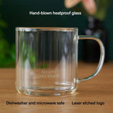 Clear glass mug for tea from August Uncommon Tea, showcasing its elegant, transparent design and smooth handle.