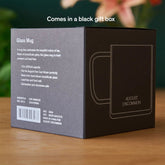 Clear glass mug from August Uncommon Tea, elegant teaware with a sleek design, perfect for enjoying hot beverages.