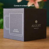 Clear glass mug from August Uncommon Tea, elegant teaware with a smooth, transparent design perfect for enjoying tea.