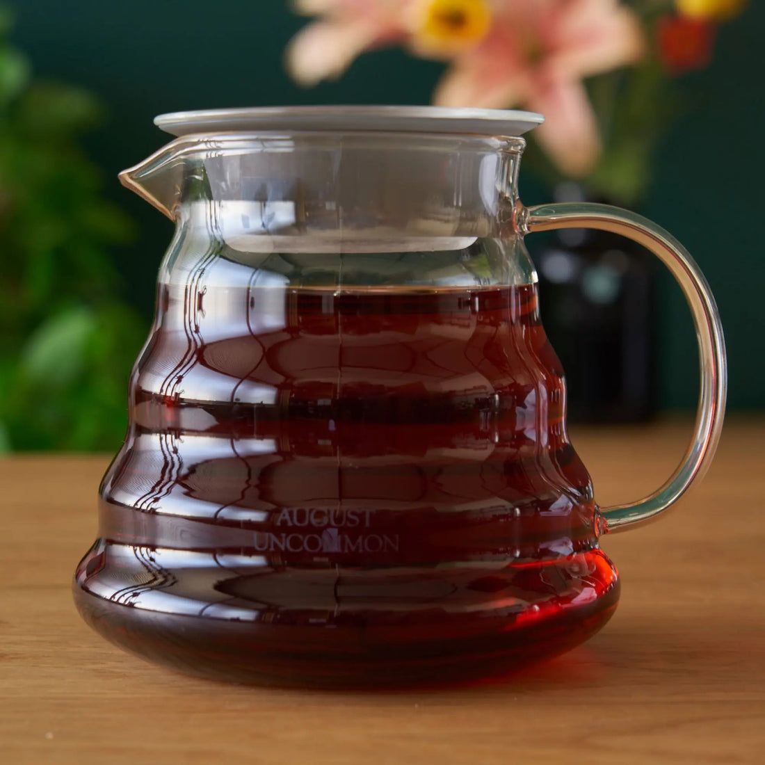 Two cup glass teapot from August Uncommon Tea, clear teaware for brewing and serving tea with a modern design.
