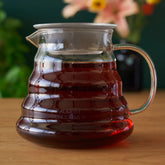Two cup glass teapot from August Uncommon Tea, clear teaware for brewing and serving tea with a modern design.