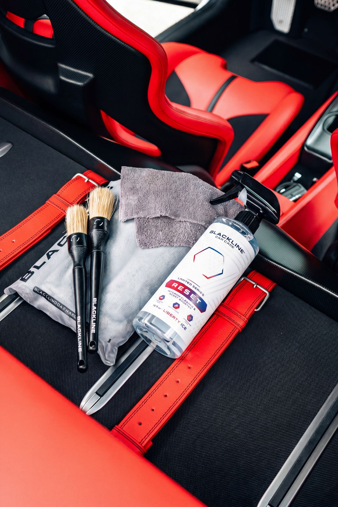 Blackline Car Care BLACKLINE® Reset Interior Cleaner and Scent Booster bottle with label and spray nozzle.