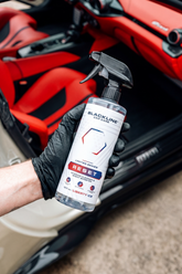 Blackline Car Care BLACKLINE® Reset Interior Cleaner and Scent Booster bottle with label and spray nozzle.