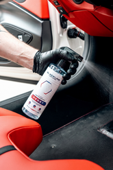 Blackline Car Care BLACKLINE® RESET interior cleaner and scent booster bottle, with label and spray nozzle visible.
