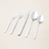Italic Emilia Mirror 20-piece flatware set featuring stainless steel forks, knives, spoons with a sleek, polished finish.