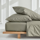 Luxurious Australian sateen sheet set by Italic, showing smooth, soft bed sheets in a cozy bedroom setting.