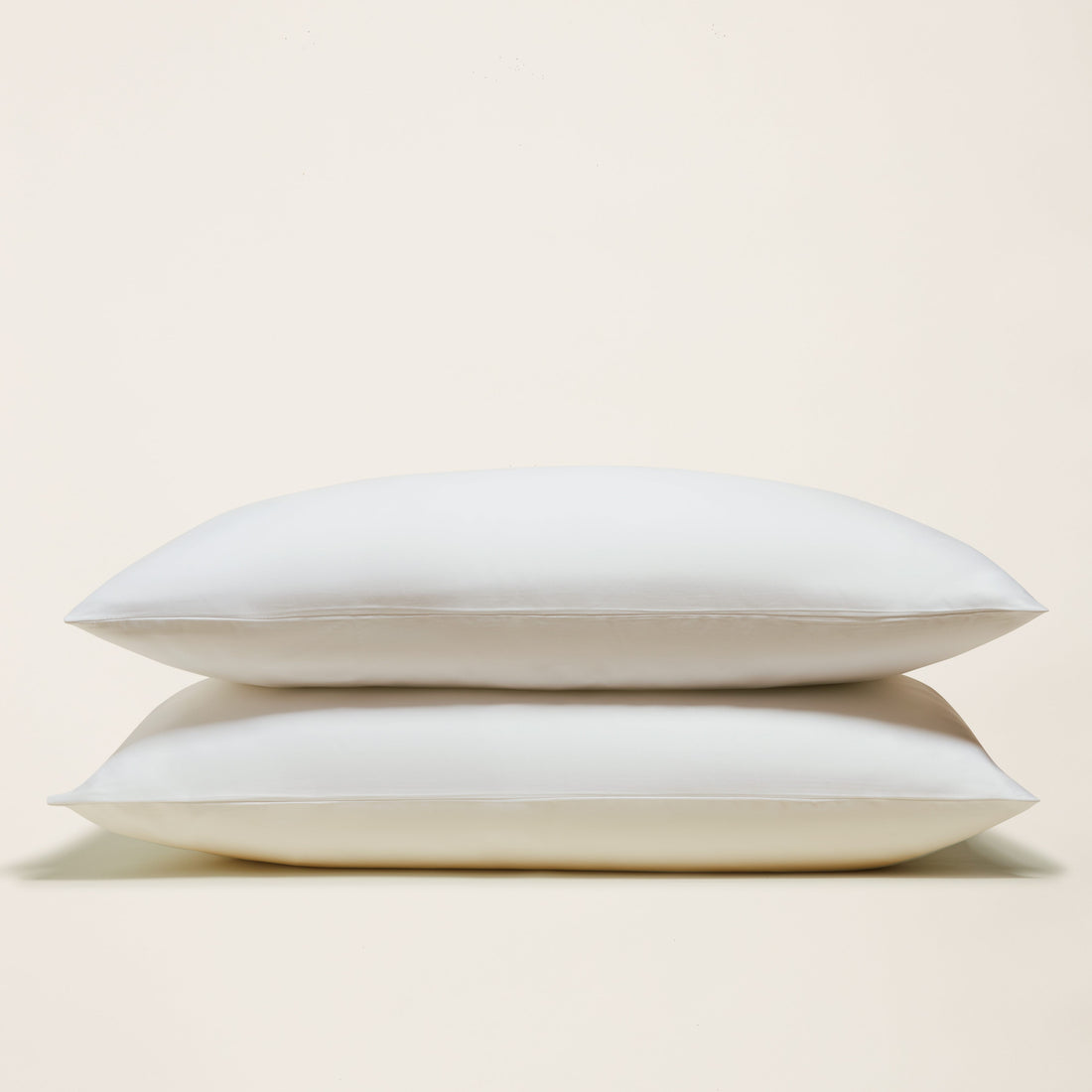 Italic Luxe Australian Sateen Pillowcase Set featuring smooth, soft satin pillowcases on a bed for luxurious sleep comfort.