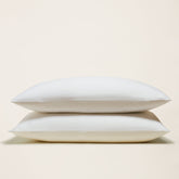 Italic Luxe Australian Sateen Pillowcase Set featuring smooth, soft satin pillowcases on a bed for luxurious sleep comfort.