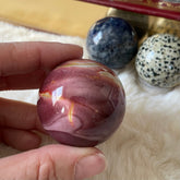 Clear 40mm crystal sphere from Evermore Everlasting, smooth and polished glass decorative ornament on a plain background.