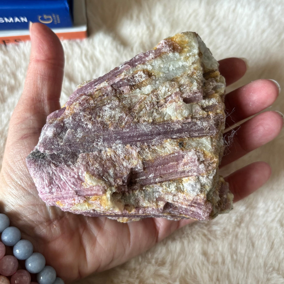 Raw pink tourmaline gemstone from Evermore Everlasting, showing its natural pink color and unpolished, rough crystal form.