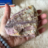 Raw pink tourmaline gemstone from Evermore Everlasting, showing its natural pink color and unpolished, rough crystal form.