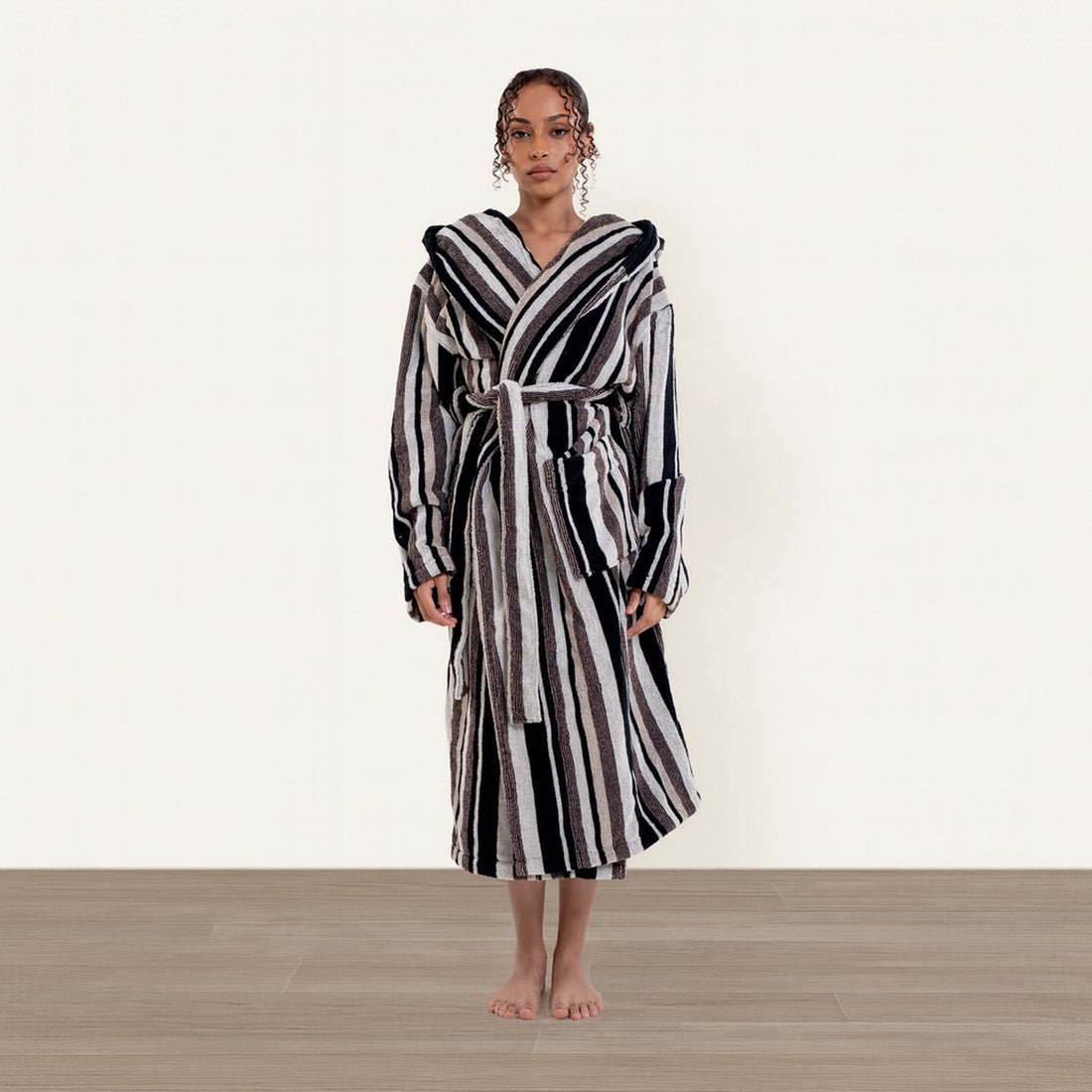 Unisex Ultraplush Australian Cotton bathrobe by Italic, soft, plush fabric with a relaxed fit and tie waist, displayed on a hanger.