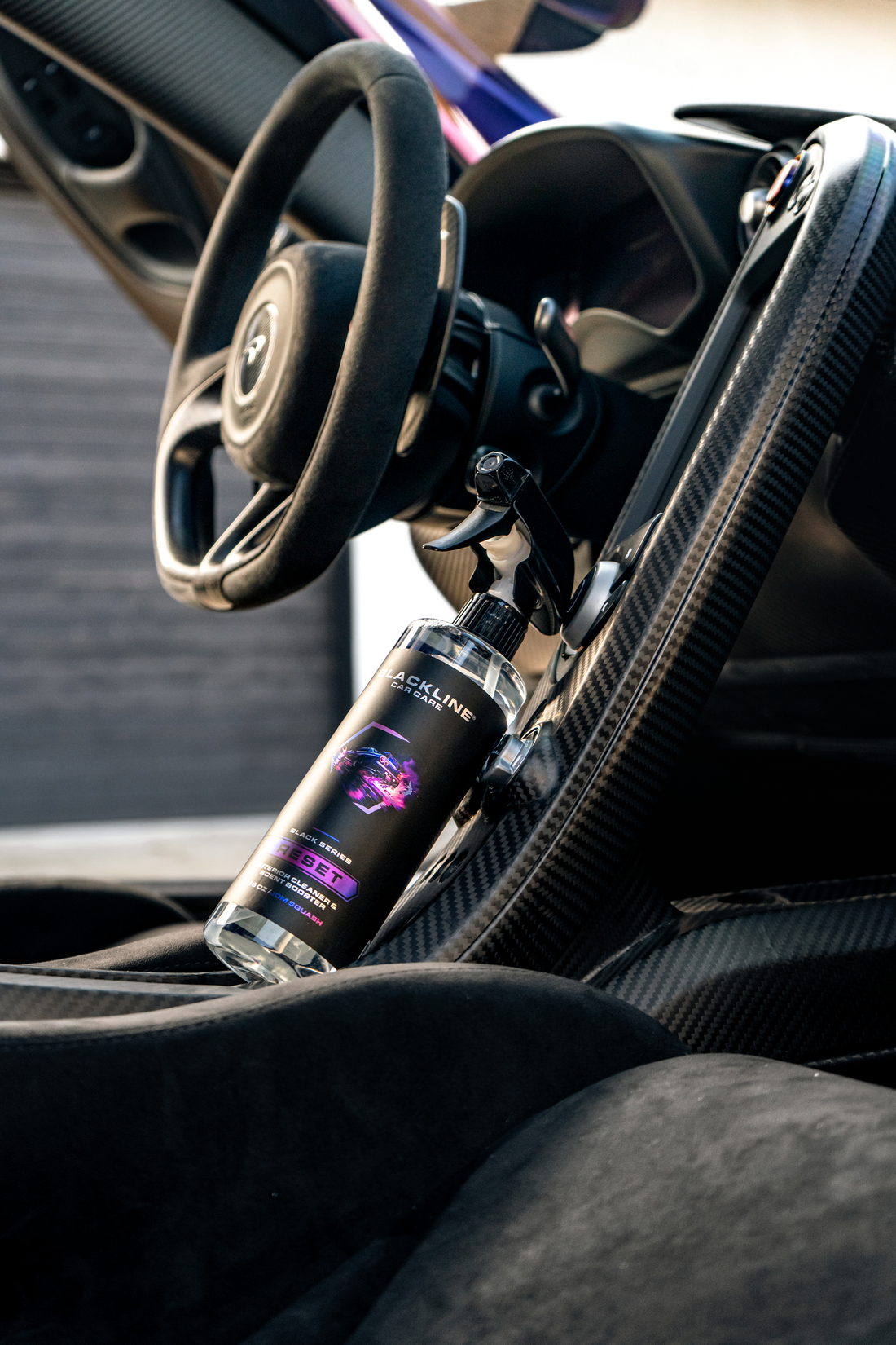 Blackline Car Care BLACKLINE® Reset interior cleaner and scent booster bottle with label and blue cap.
