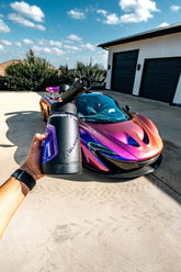 Blackline Car Care BLACKLINE® Ultra Series Foam Cannon attached to a garden hose, producing thick foam for car washing.