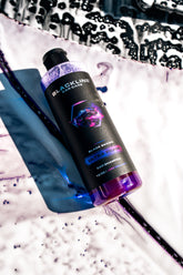 Blackline Car Care BLACKLINE® Ultra Foam car shampoo being applied to a vehicle for a thorough wash and cleaning.
