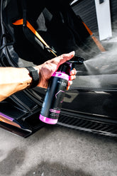 Blackline Car Care BLACKLINE® SPEED GLOSS Quick Detailer gloss spray bottle with applicator pad on a car surface.