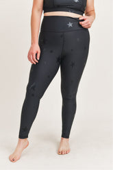 High-waisted Starlight leggings by Fitkitty Culture, featuring a dark fabric with subtle star patterns, designed for yoga and active wear.
