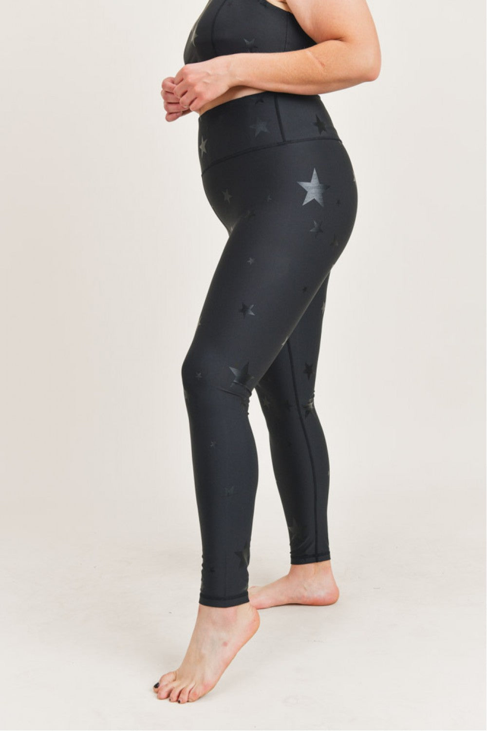 High waisted Starlight leggings from Fitkitty Culture, featuring a starry pattern and stretchy fabric for active wear and yoga.
