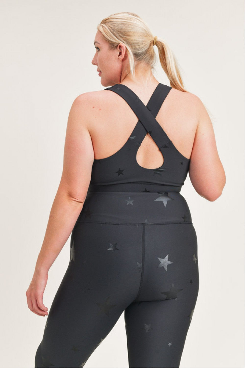 Fitkitty Culture Starlight Star foil sports bra with metallic design, supportive fit, ideal for yoga and active wear.