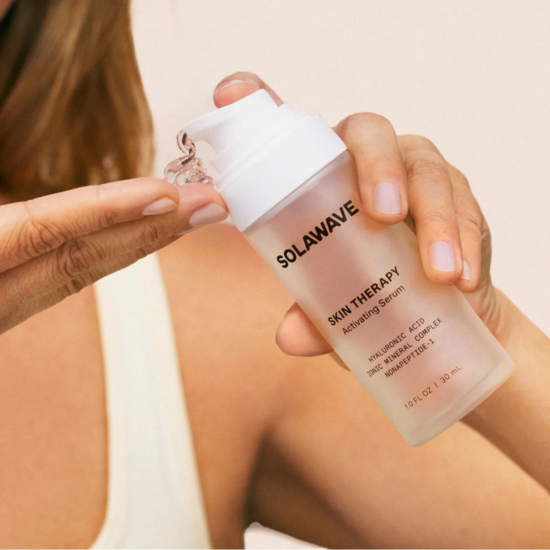 Solawave Skin Therapy Activating Serum in a sleek dropper bottle, ready for skincare application.