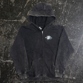 Black Agnostic zip-up hoodie by Any Means Necessary Clothing, front view showing hoodie with full zip and casual fit.