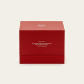 Soy wax ceramic candle by Italic featuring a sleek, minimalist design with a white ceramic holder and a lit wick.