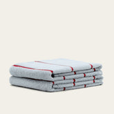 Soft Deia Australian cotton towel from Italic, displayed on a bed, showing its plush texture and quality for home or bedroom use.