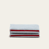 White Deia Australian Cotton Towels by Italic, soft and plush for home and bed use, shown folded on a clean surface.