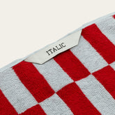 White Pietra Australian Cotton Towels by Italic, soft and plush with a textured weave, displayed hanging on a towel rack.
