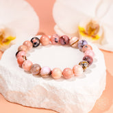 Peruvian Pink Opal bracelet by Conscious Items featuring polished pink gemstone beads on an elastic stretch cord.