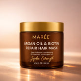 Maree Argan Oil and Biotin Hair Repair Mask in a jar, showing the creamy treatment with natural ingredients for damaged hair.
