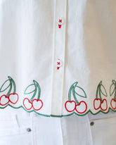 Cherry Cute Button Down top by Downeast, featuring a playful cherry print and classic button-up design.