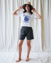 Downeast On Repeat Short, casual denim shorts with distressed detailing and frayed hem, styled for a relaxed summer look.