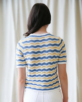 Downeast High Tides sweater featuring a cozy knit design in soft blue and white tones, perfect for casual wear.