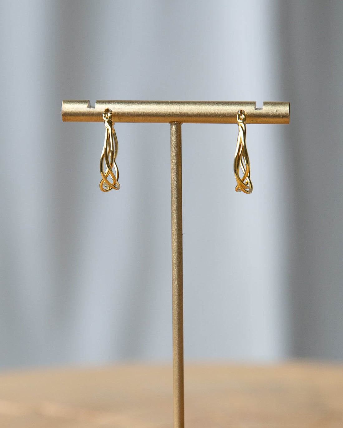 Downeast braided hoop earrings featuring a stylish, twisted design perfect for adding a touch of elegance to any outfit.