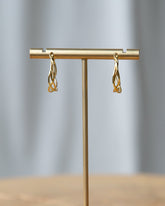Downeast braided hoop earrings featuring a stylish, twisted design perfect for adding a touch of elegance to any outfit.