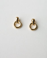 Downeast Icon Earrings hanging with a sleek, modern design, featuring polished metal and minimalist style.