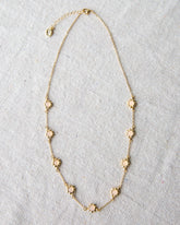 Downeast mini flower necklace featuring delicate floral pendant on a fine chain, perfect for everyday wear.