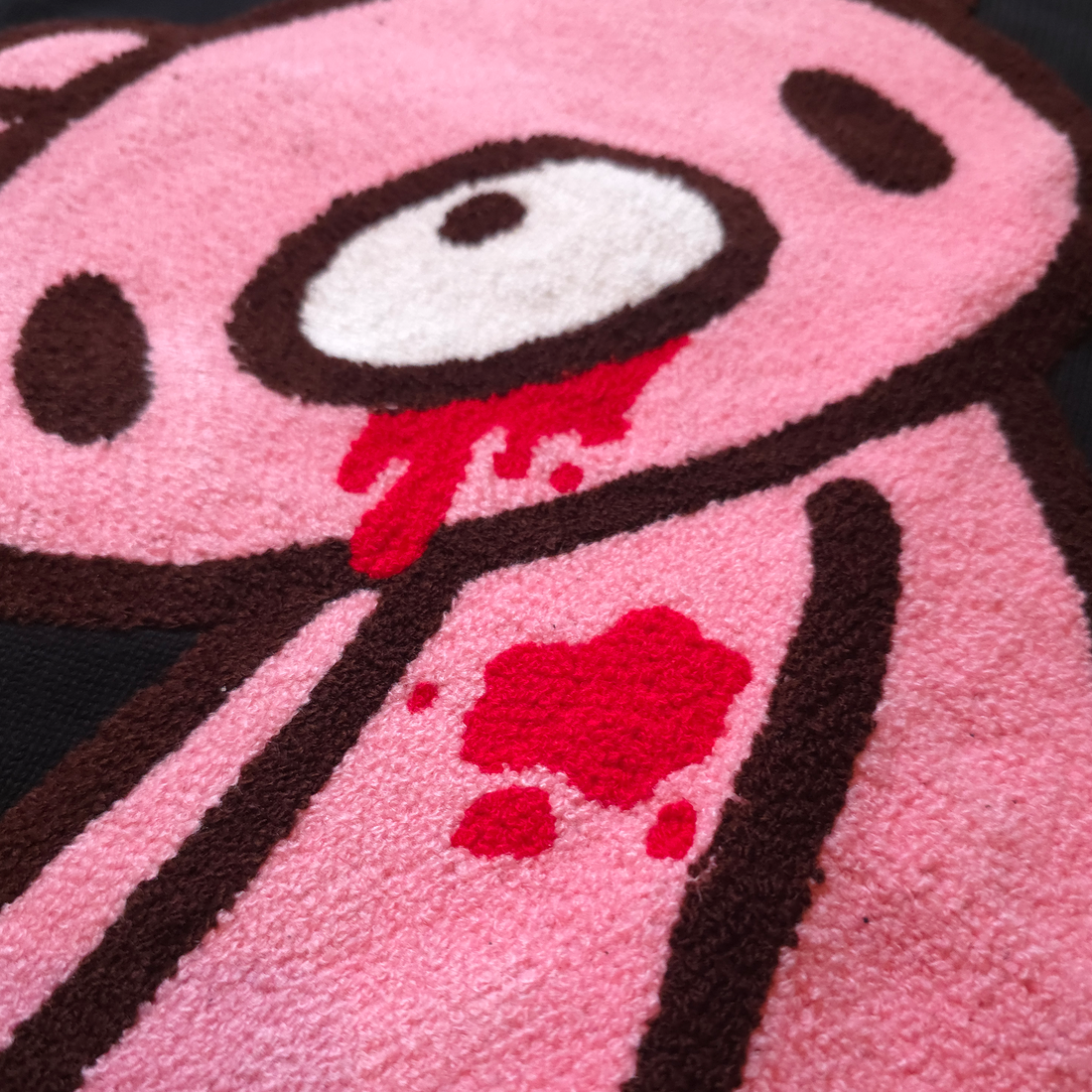 Close-up of a Big Gloomy Knit Sweater by Any Means Necessary Clothing, showing its textured dark knit fabric and cozy fit.