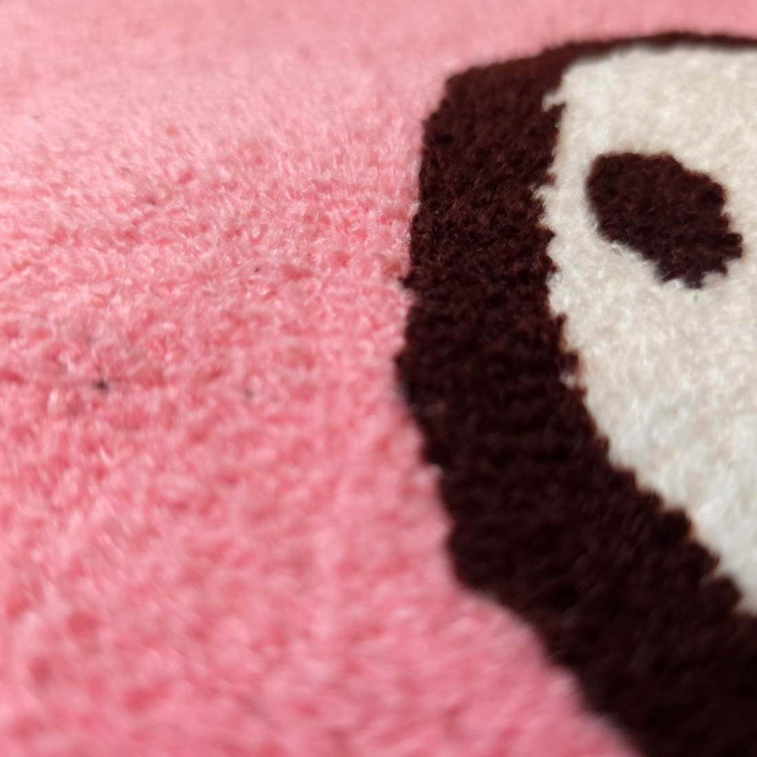 Close-up of the Big Gloomy Knit Sweater by Any Means Necessary Clothing, showing its textured black knit fabric and cozy fit.