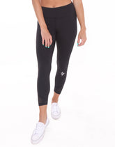 Black HydroFlex Cut Out Leggings by White Water Life, featuring stylish cutouts and a sleek, stretchy fit for active wear.