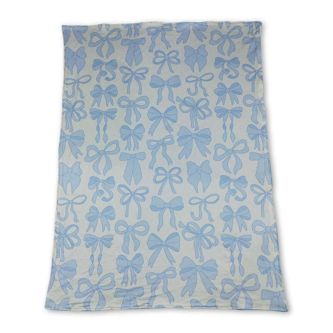 Light blue bows and white polka dots baby girl blanket made of soft minky fabric by Mini Rodeo.