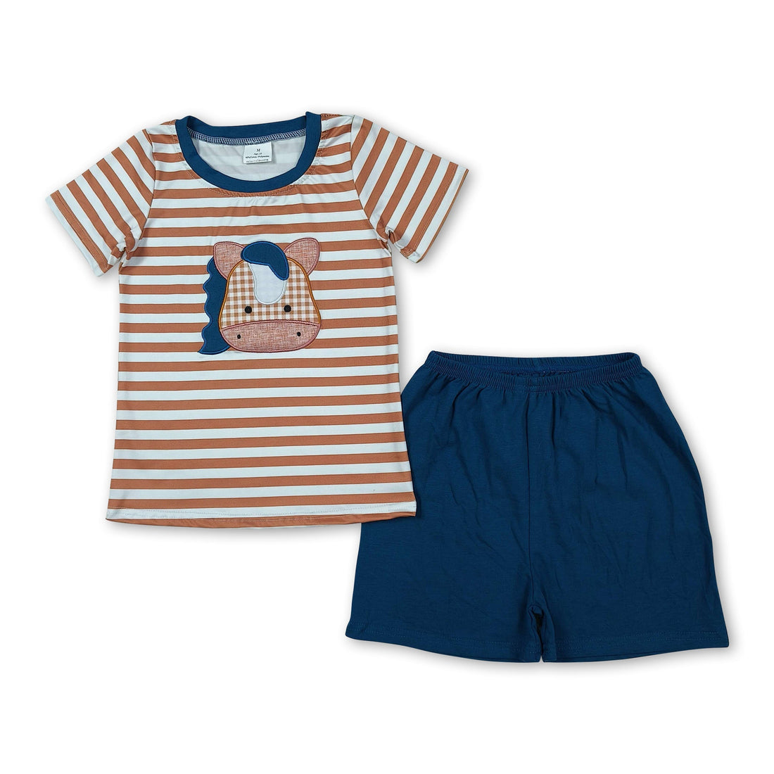 Boy wearing brown striped cows top and shorts from Mini Rodeo summer boys&