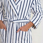 Navy striped Italic Ultraplush Australian cotton unisex bathrobe displayed on a hanger, showing soft fabric and comfortable fit.