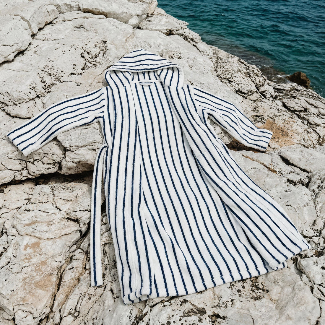 Navy striped Ultraplush Australian cotton unisex bathrobe by Italic, shown on a model with a cozy, relaxed fit.