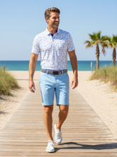 White Water Life Beachside Performance Polo displayed on a model, featuring a lightweight, breathable fabric and classic polo design.