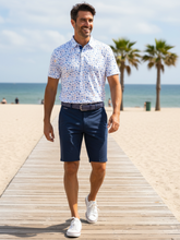 Navy Beachside Performance Polo by White Water Life, featuring a casual fit and breathable fabric, displayed on a hanger.