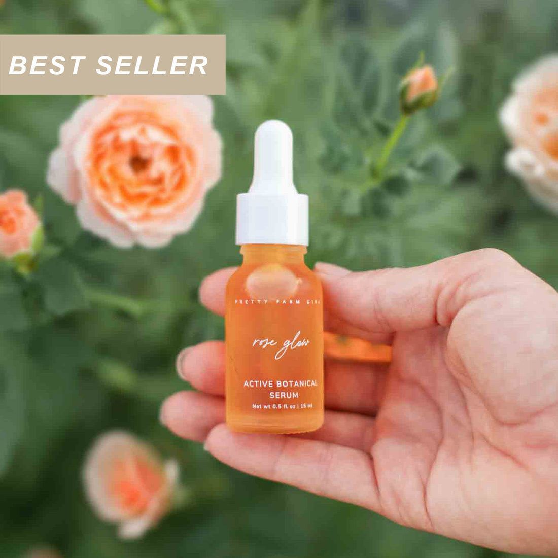 Pretty Farm Girl Rose Glow anti-aging face serum with a best-seller label, featuring a clear glass bottle and soft pink accents.