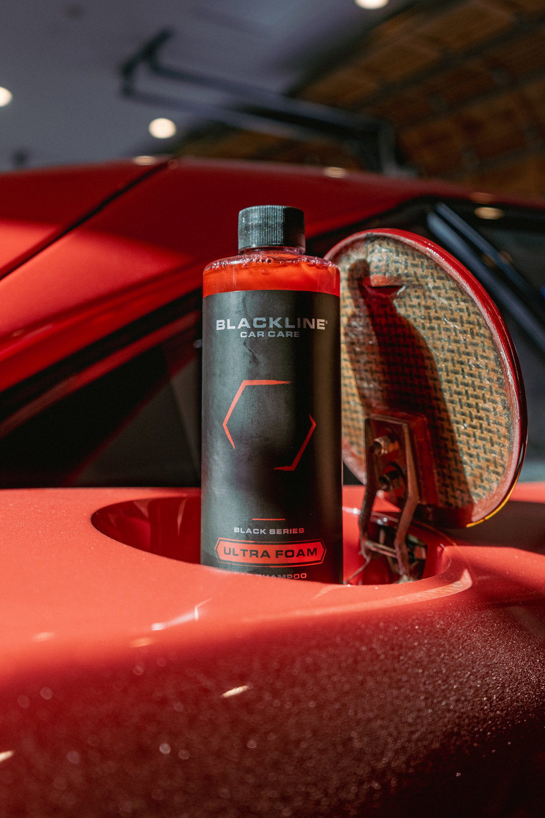 Blackline Car Care BLACKLINE® Ultra Foam car shampoo in a 16oz bottle with cotton candy color label, ready for vehicle cleaning.